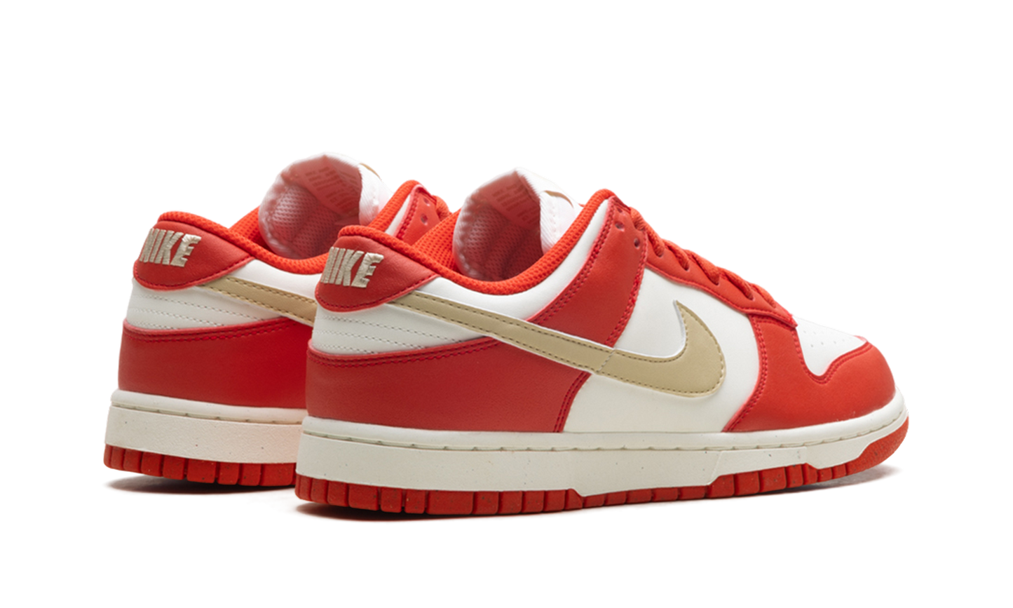 Dunk Low Next Nature WMNS "Light Crimson Team Gold"